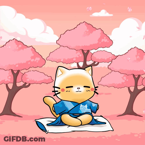 A Cat In A Blue Kimono Sits On A Pillow In Front Of Pink Trees GIF