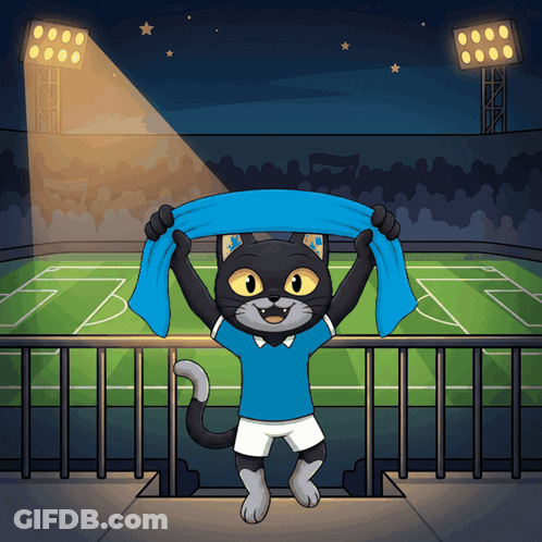 A Cat In A Blue Shirt Holds A Blue Scarf Over Its Head GIF