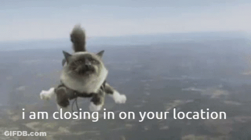 A Cat Is Flying Through The Air With The Words " I Am Closing In On Your Location " GIF