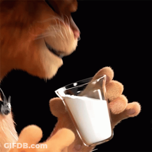 A Cat Is Holding A Glass Of Milk In Its Paw GIF
