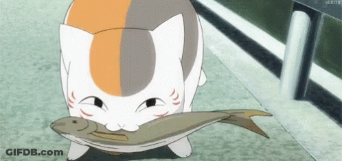 A Cat Is Holding A Large Fish In Its Mouth GIF