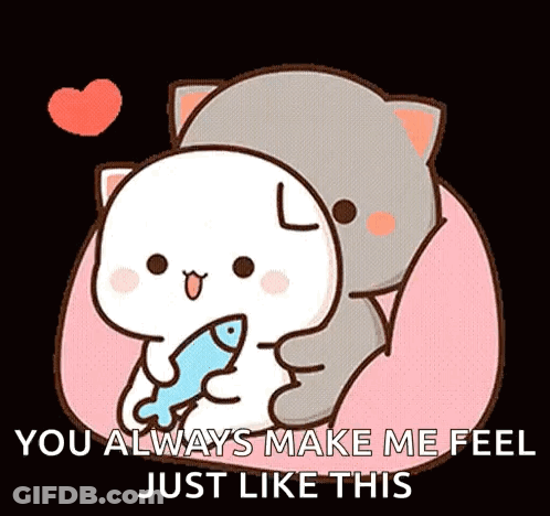 A Cat Is Hugging A White Cat With A Fish In Its Mouth . GIF