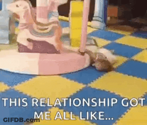 A Cat Is Laying On A Checkered Floor Next To A Carousel And Says `` This Relationship Got Me All Like ... '' . GIF