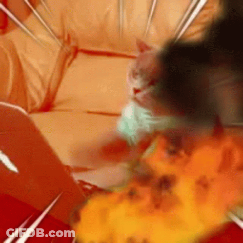A Cat Is Laying On A Couch With A Fireball In The Background . GIF