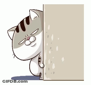 A Cat Is Peeking Out From Behind A Wall And Looking At The Camera . GIF
