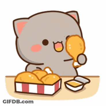 A Cat Is Sitting At A Table Eating Fried Chicken GIF