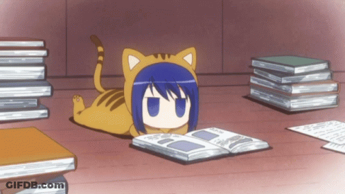 A Cat Laying On The Floor Reading A Book Next To A Pile Of Books GIF