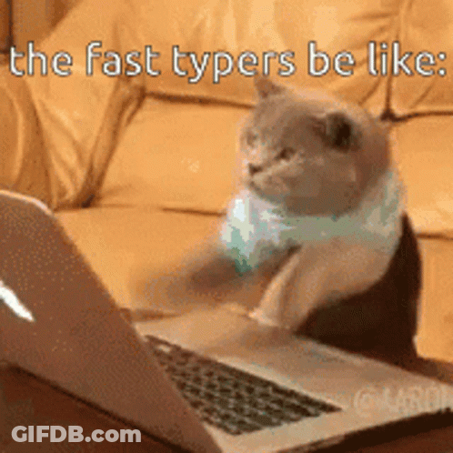 A Cat Sitting In Front Of A Laptop With The Words " The Fast Typers Be Like " GIF