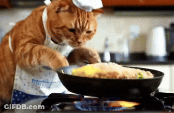 A Cat Wearing A Chef 'S Hat And Apron Cooking Food In A Frying Pan GIF