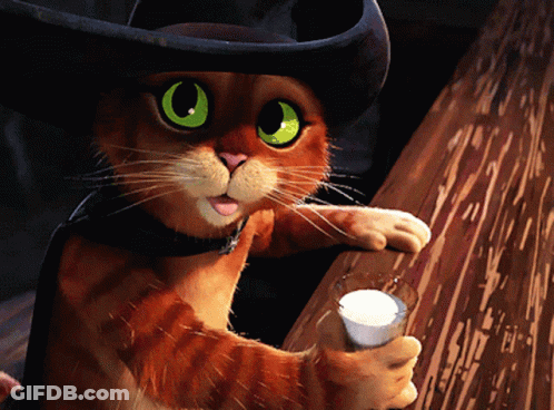 A Cat Wearing A Cowboy Hat Is Holding A Cup Of Milk GIF