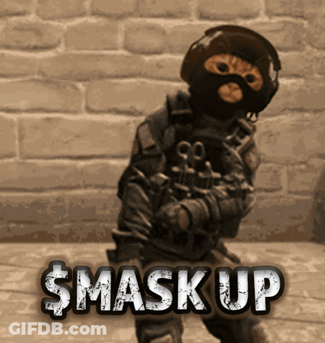 A Cat Wearing A Gas Mask Stands In Front Of A Brick Wall With The Words $ Mask Up Written Above Him GIF