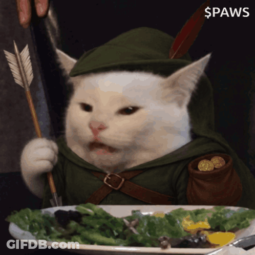 A Cat With A Bow And Arrow Is Eating A Salad GIF