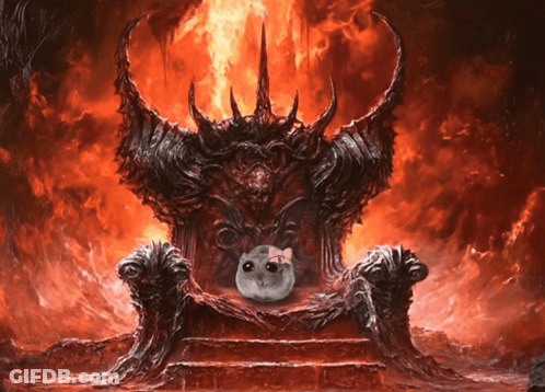 A Cat With A Pink Bow Sits On A Throne In Front Of A Fire GIF