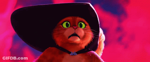 A Cat With Green Eyes Wearing A Hat GIF
