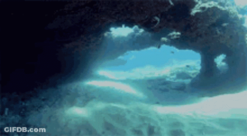 Ocean Cave With Sunlight Shining Through GIF