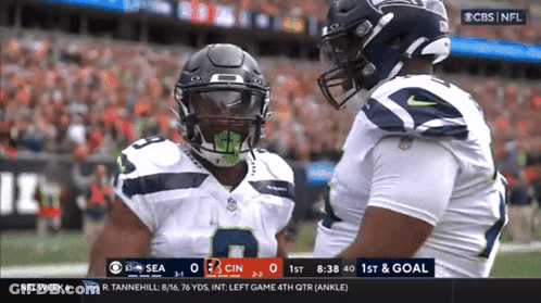 A Cbs NFL Broadcast Of A Football Game Between The Seahawks And The Cincinnati Titans GIF