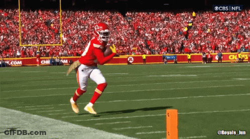 A Cbs Nfl Broadcast Of A Football Game Shows A Player Catching The Ball GIF
