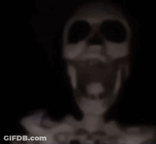 A Ceiling Fan Is Hanging From The Ceiling In A Room . GIF