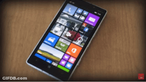 A Cell Phone Displays A Grid Of Icons Including One That Says ' A ' On It GIF