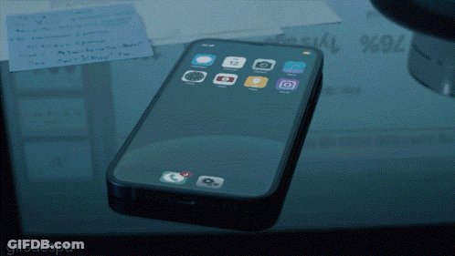 A Cell Phone Laying On A Glass Table With A Gifsaespa Watermark At The Bottom GIF