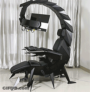 A Chair That Looks Like A Scorpion With A Computer On Top GIF