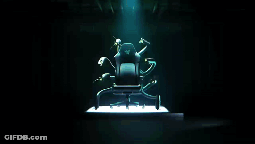 A Chair With A Razer Logo On It Is Surrounded By Monsters GIF