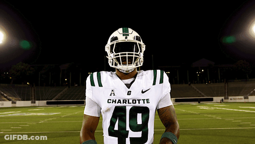 A Charlotte Football Player Wearing Number 49 Poses For A Photo GIF