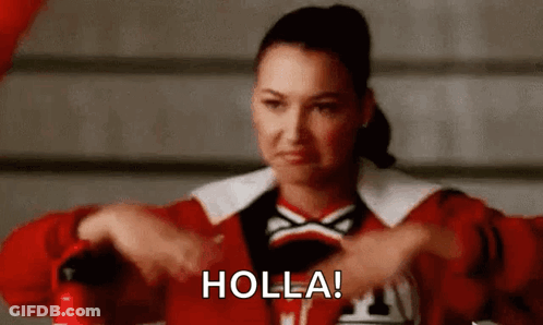 A Cheerleader Is Holding A Fire Extinguisher And Making A Face . GIF