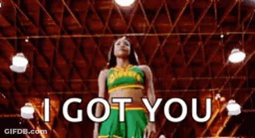A Cheerleader Is Standing In A Gym With The Words `` I Got You '' Written On The Screen . GIF