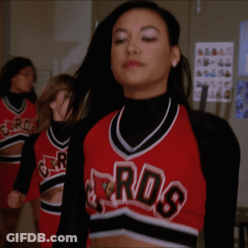 A Cheerleader Wearing A Red And Black Jersey With The Word Rds On It GIF