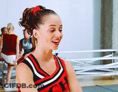 A Cheerleader Wearing A Red Black And White Uniform With The Letter Ch On The Front GIF