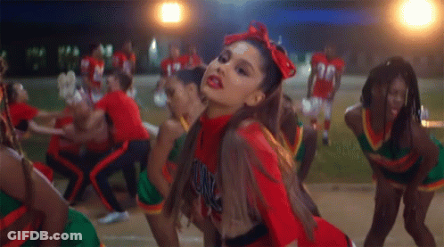 A Cheerleader Wearing A Red Uniform With The Word Unc On The Front GIF