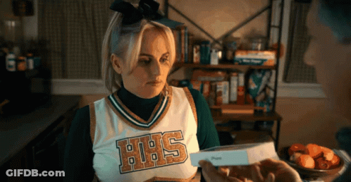A Cheerleader Wearing A Uniform That Says Hhs On It GIF