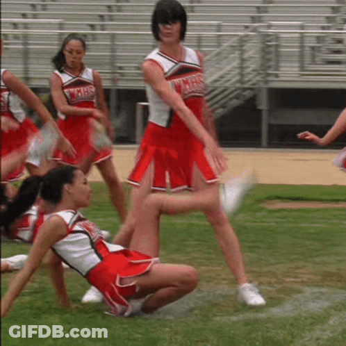 A Cheerleader Wearing A Uniform That Says Wmhs On It GIF