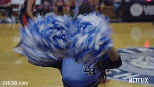 A Cheerleader With The Letter L On The Back Of Her Jersey GIF