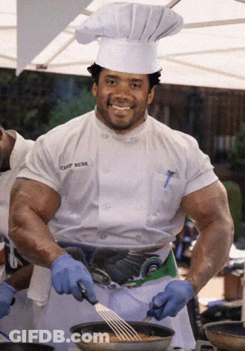 A Chef Wearing A White Shirt That Says Chef Rusk GIF