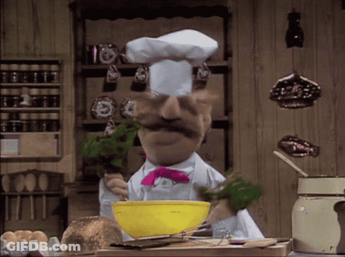 A Chef With A Mustache And A Pink Bow Tie Is Mixing Something In A Yellow Bowl GIF