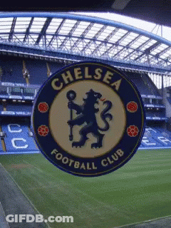 A Chelsea Football Club Logo Is Displayed In Front Of A Soccer Field GIF