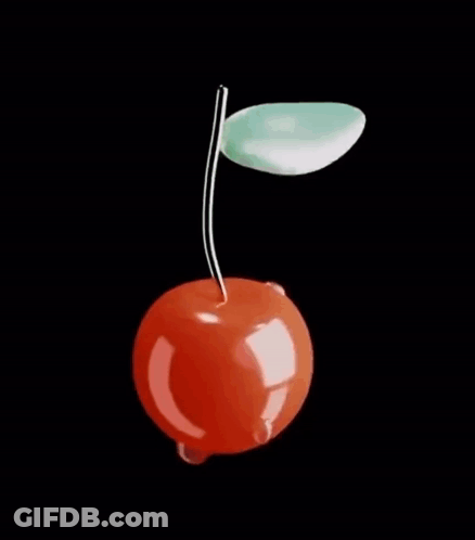 A Cherry With A Green Leaf On A Black Background . GIF