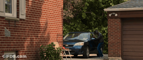 A Chevrolet Car Is Parked In Front Of A House GIF