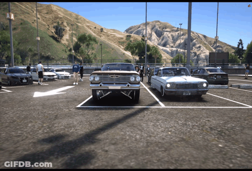A Chevrolet Impala Is Parked Next To A Mustang GIF