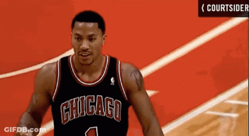 A Chicago Bulls Basketball Player Wearing A Black Jersey With The Number 1 On It GIF