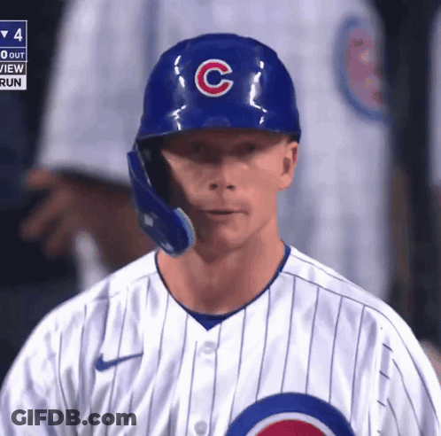 A Chicago Cubs Baseball Player Wearing A Blue Helmet With The Letter C On It GIF