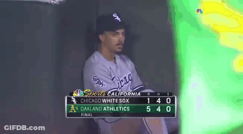 A Chicago White Sox Baseball Player Sits In The Dugout During A Game Against The Oakland Athletics GIF