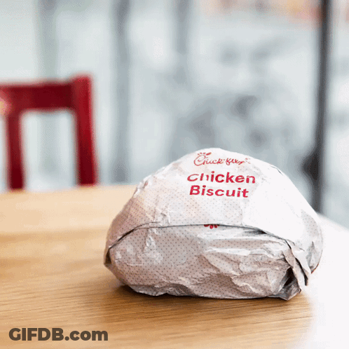 A Chick-Fil-A Chicken Biscuit Is Wrapped In Paper GIF