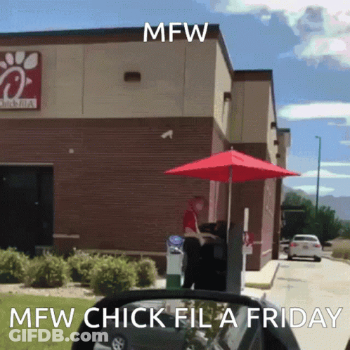 A Chick-Fil-A Drive-Thru With A Red Umbrella In Front Of It GIF