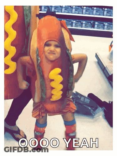 A Child Dressed As A Hot Dog With The Words Oooo Yeah Below Him GIF