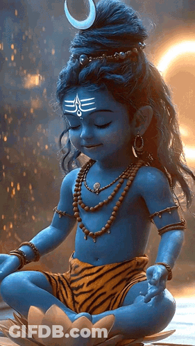 A Child Dressed As Shiva Sits In A Lotus Position With His Eyes Closed GIF