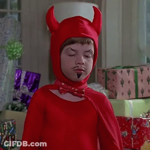 A Child Dressed In A Red Devil Costume With Horns And A Mustache GIF
