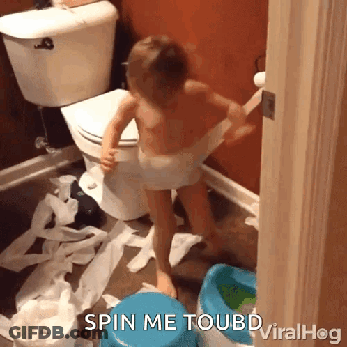 A Child In A Diaper Is Playing With Toilet Paper In A Bathroom With The Caption Spin Me Toubd Viralhog GIF